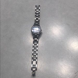 Fossil woman’s small face watch